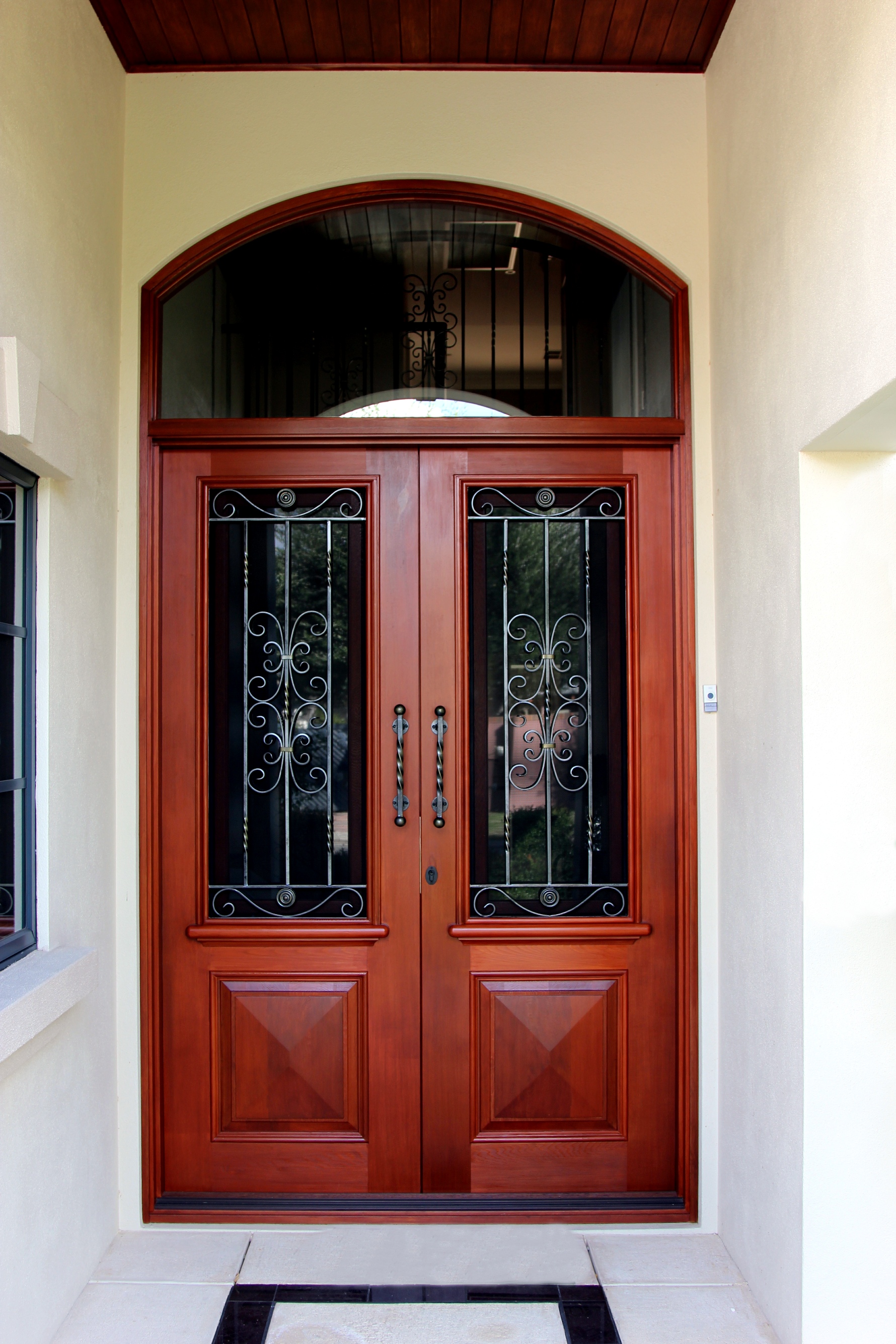 Chatsworth doors with arched transom window above