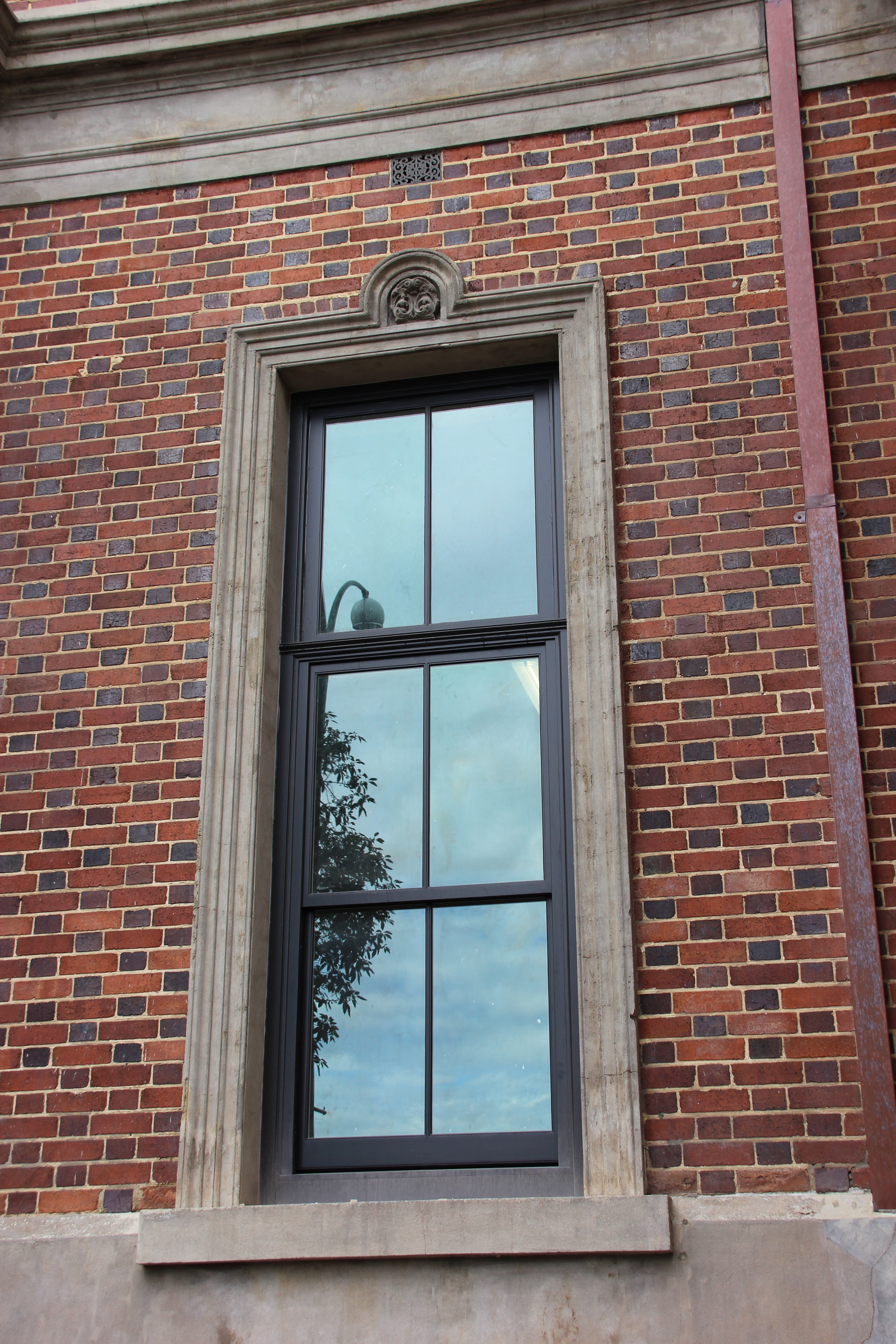 Double-hung timber windows with glazing bars