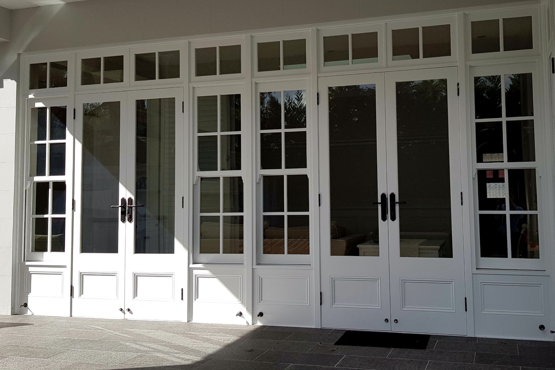 Custom timber joinery by Cedar West with timber glazing bars