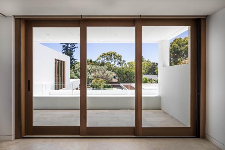 Stacking door flyscreen blinds above Cedar West