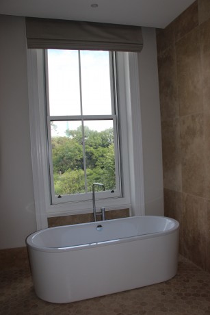 Double hung timber window bathroom painted white Cedar West