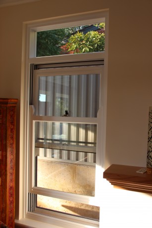 Double hung window painted timber white joinery Cedar West