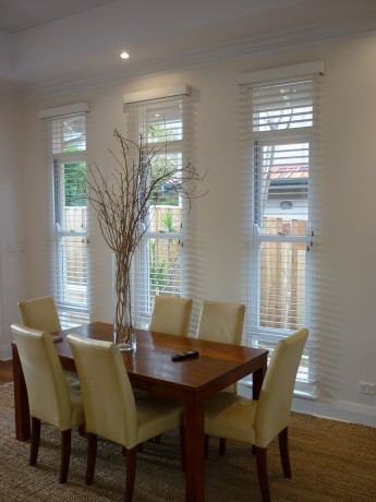 Double hung windows dining room painted white Cedar West