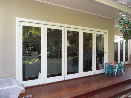 Bifold doors painted white timber fully glazed Cedar West