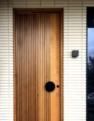Prahran Modernstyle door with black round handle Cedar West