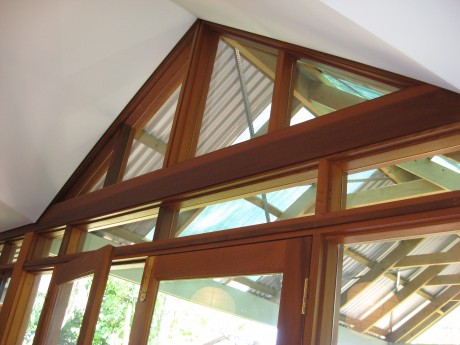 Fixed window clear glass triangular timber frames Cedar West