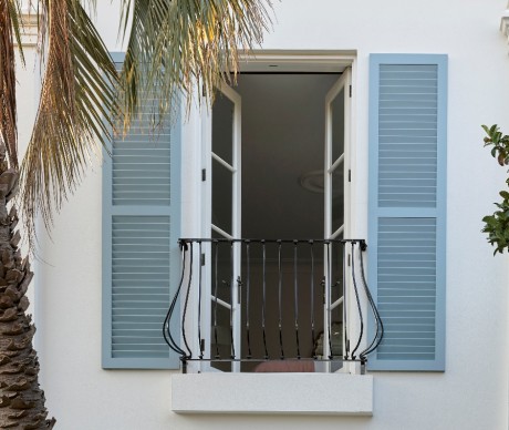 External timber shutters painted blue Juliette balcony Cedar West