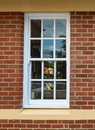 Double hung timber window red brick Cedar West