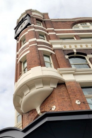Newcastle East clock tower curved windows bent glass Cedar West